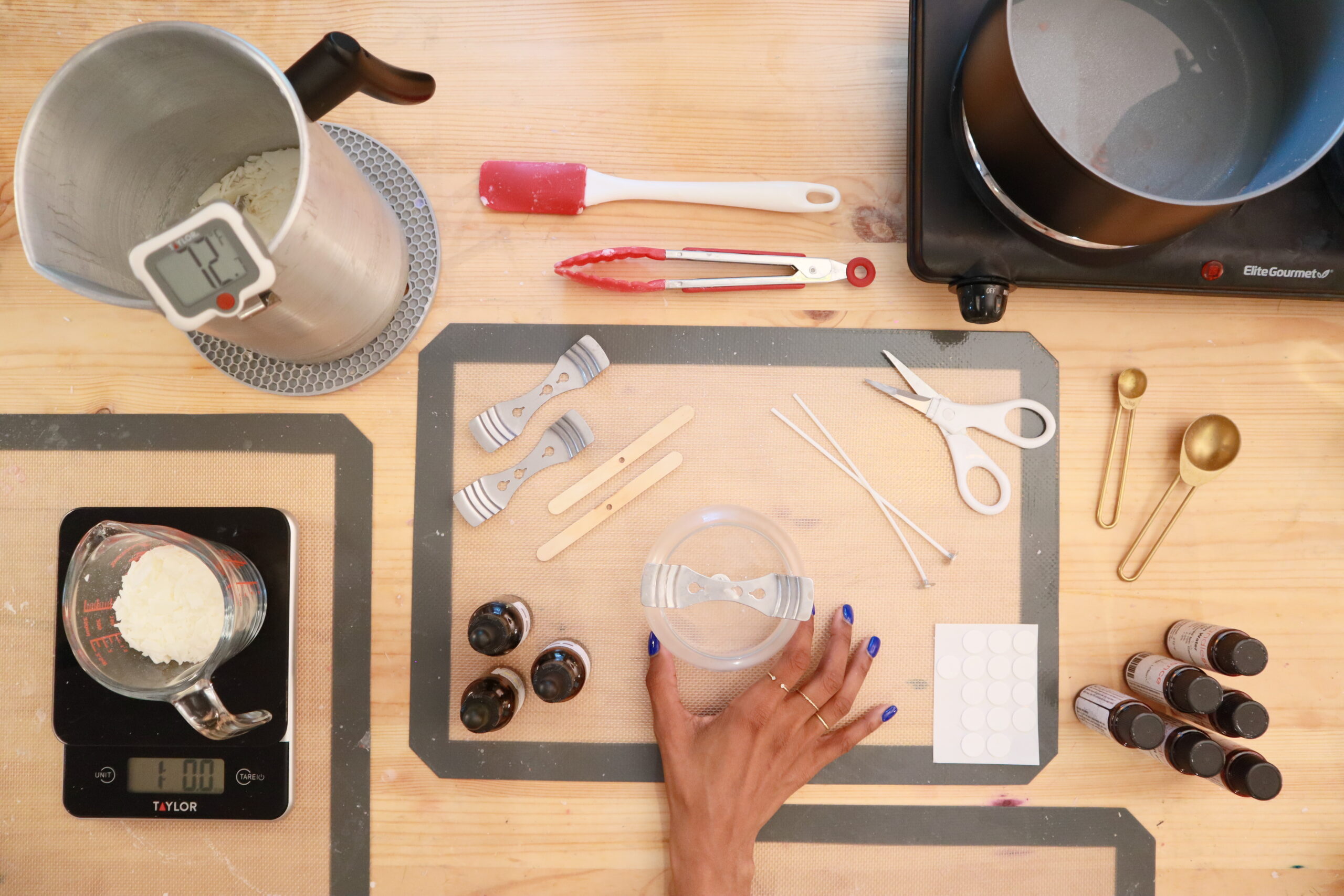 overhead-view-of-candlemaking-supplies-on-a-wooden-table