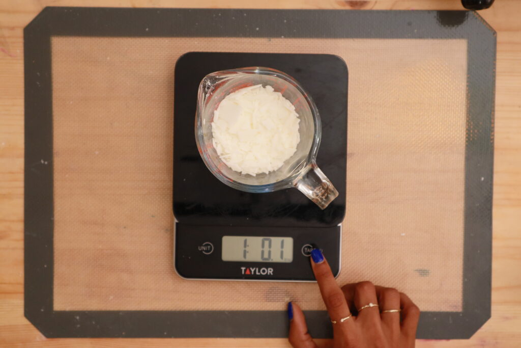 measuring-candle-wax-in-measuring-cup-on-digital-scale