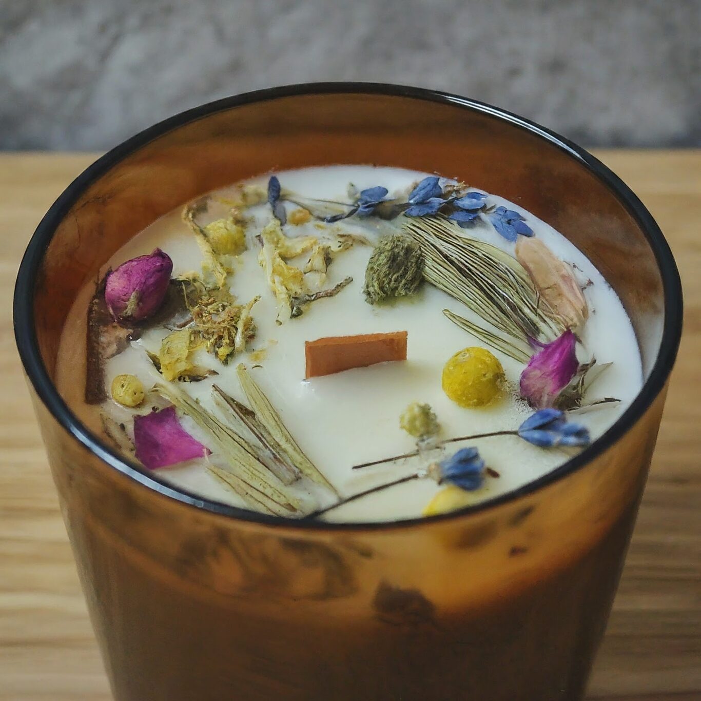 Candle-with-dried-herbs-and-flowers