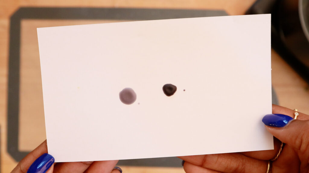 dots-of-black-candle-wax-on-white-paper