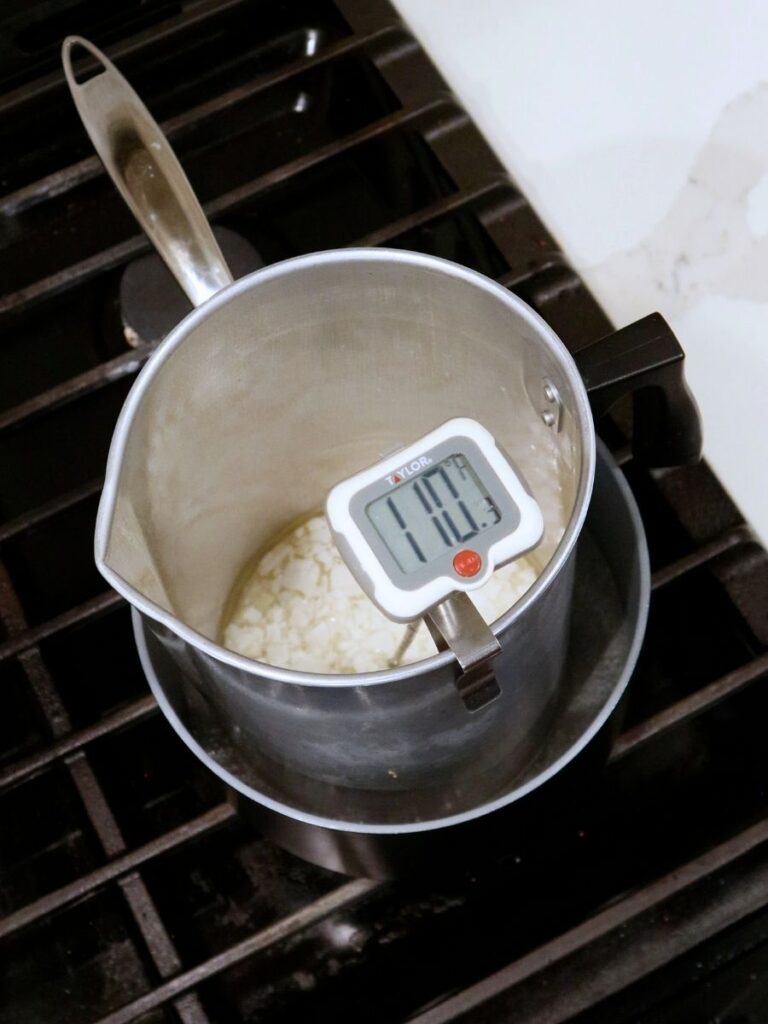 Candle wax melting inside of a double boiler.