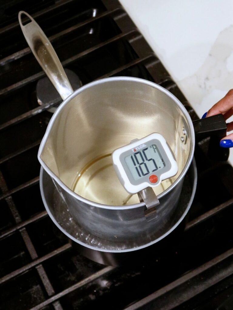 Candle wax melting inside of a double boiler.